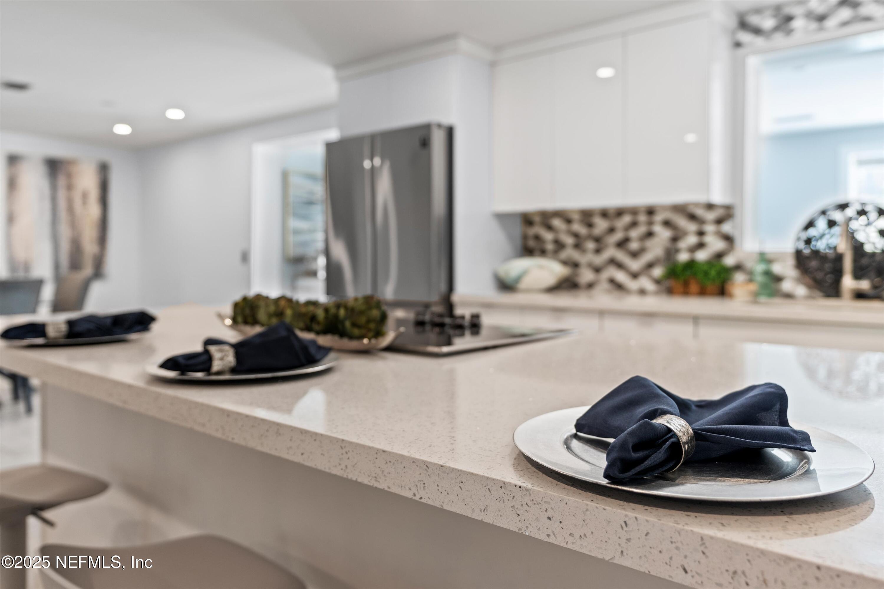 1216 Tumbleweed Drive Orange Park, FL 32065 - Photo 14 of 38 a kitchen with a sink and a potted plant