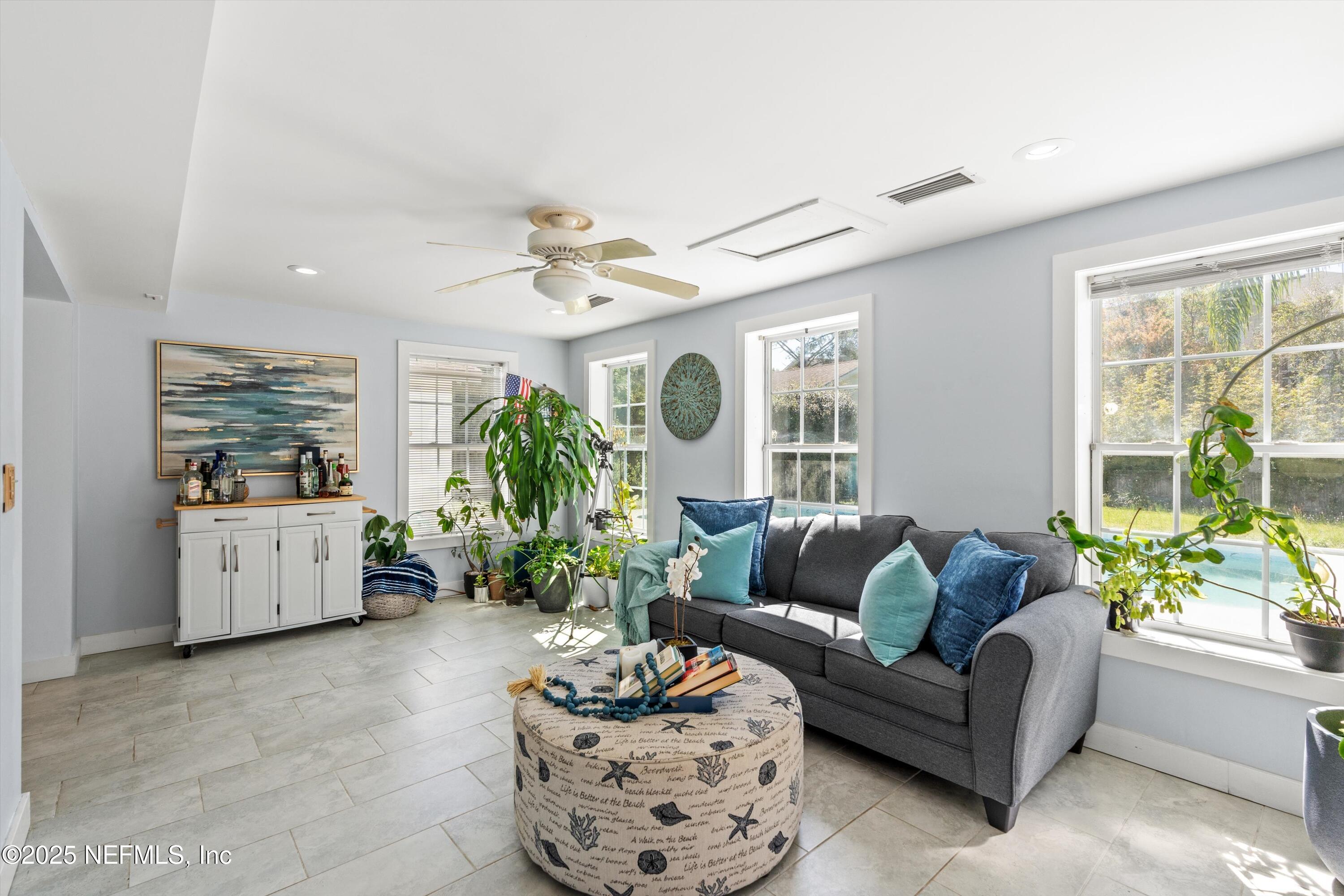 1216 Tumbleweed Drive Orange Park, FL 32065 - Photo 16 of 38 a living room with furniture and a large window