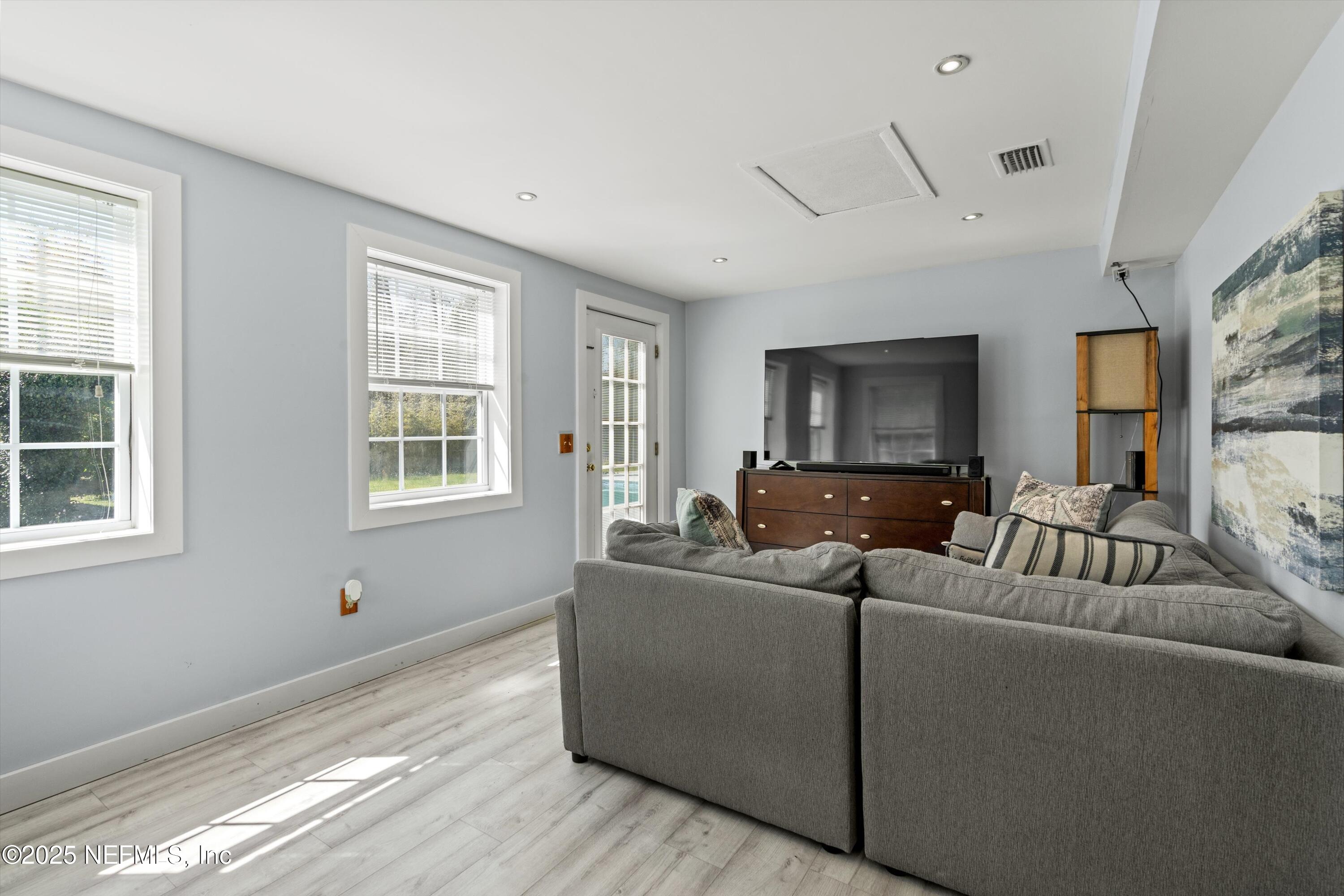 1216 Tumbleweed Drive Orange Park, FL 32065 - Photo 22 of 38 a living room with furniture and windows