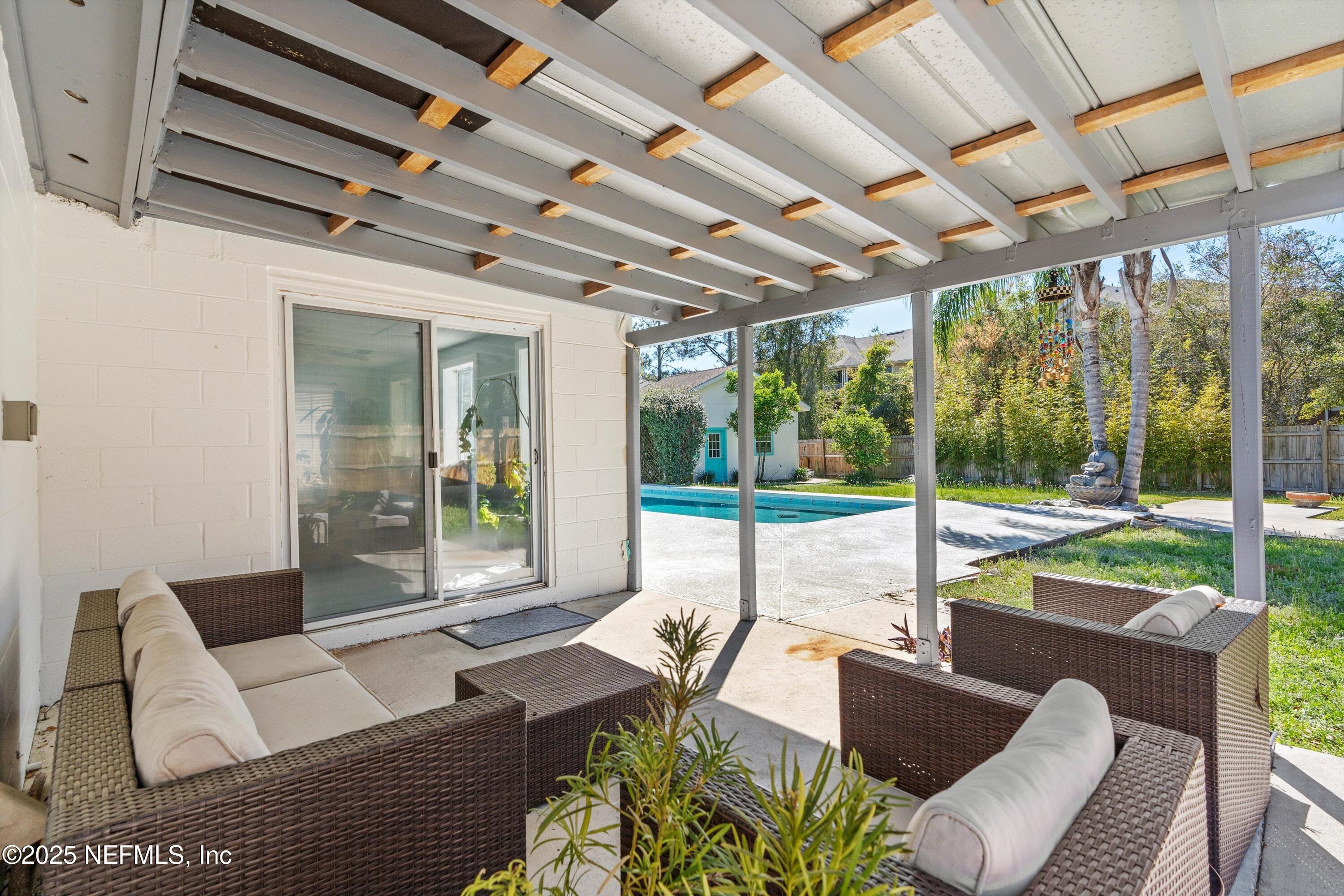1216 Tumbleweed Drive Orange Park, FL 32065 - Photo 27 of 38 a building outdoor space with patio couches and potted plant