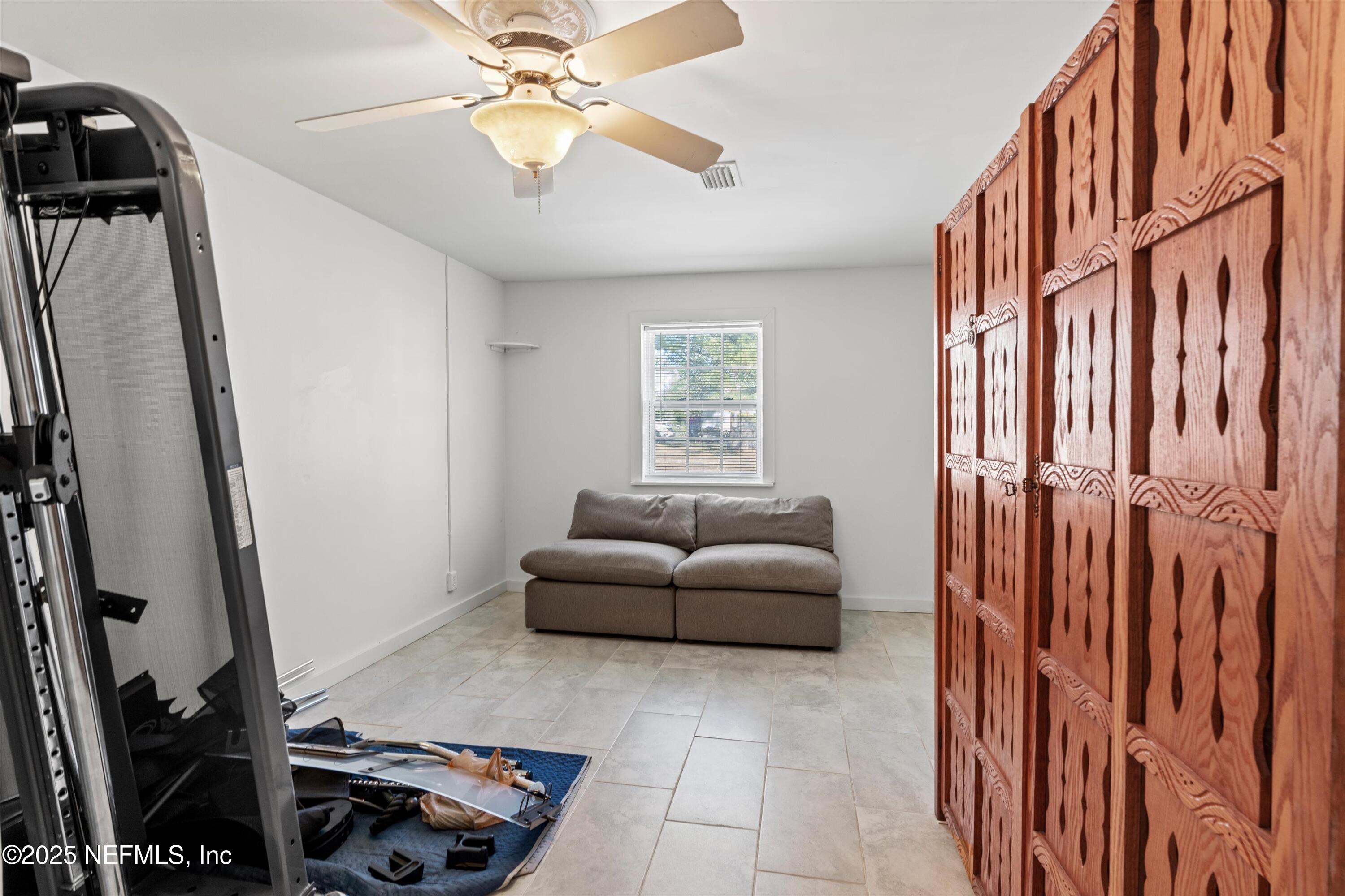 1216 Tumbleweed Drive Orange Park, FL 32065 - Photo 33 of 38 a living room with furniture and a window