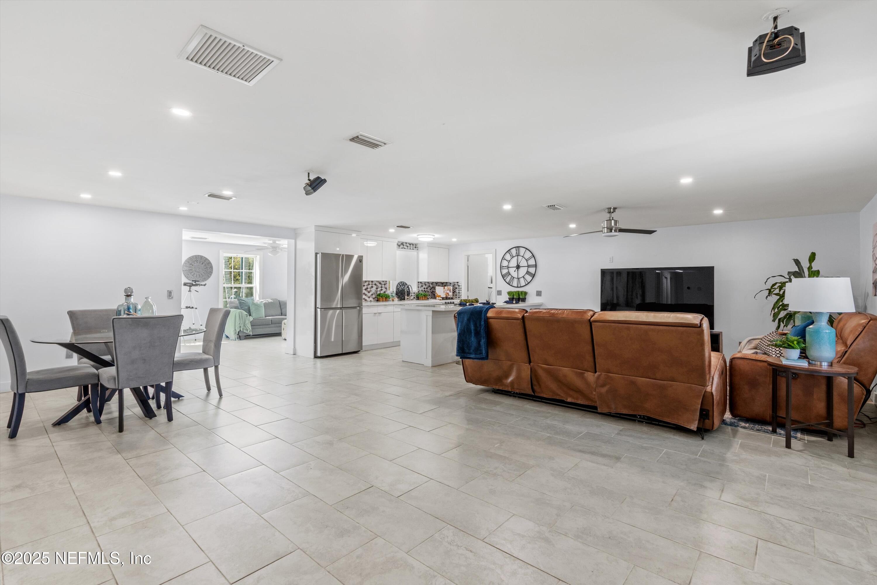 1216 Tumbleweed Drive Orange Park, FL 32065 - Photo 4 of 38 a living room with furniture and kitchen view