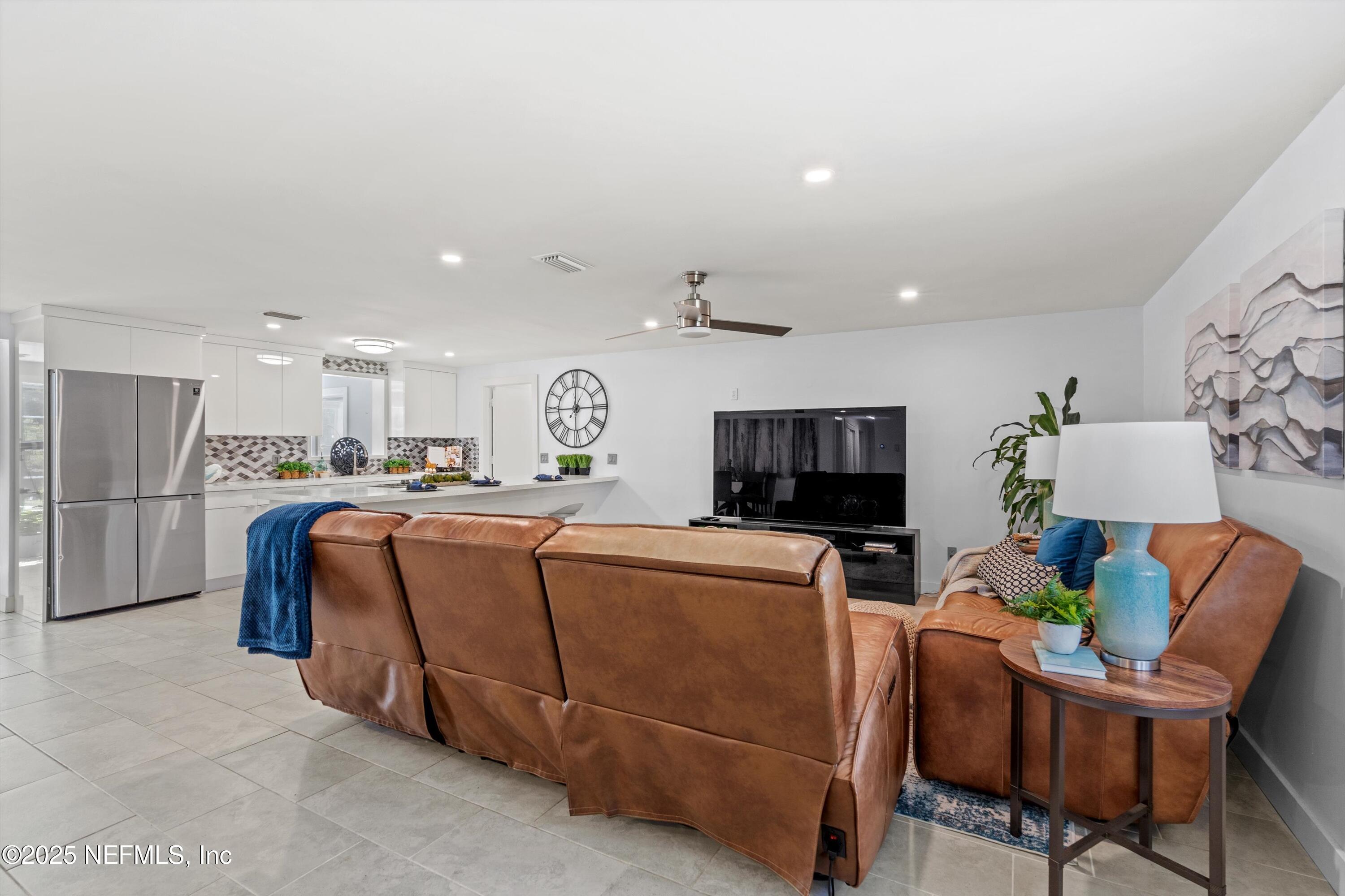 1216 Tumbleweed Drive Orange Park, FL 32065 - Photo 5 of 38 a living room with furniture and a flat screen tv