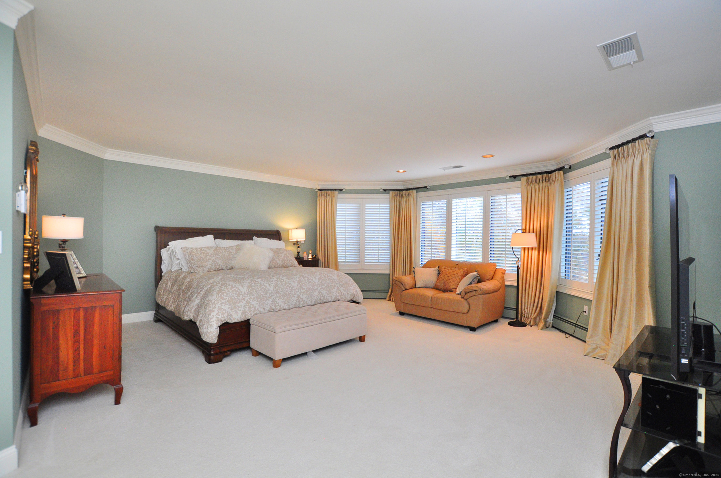 45 Lookout Landing Bolton, CT 06043 - Photo 21 of 39 a bedroom with a bed and a flat screen television