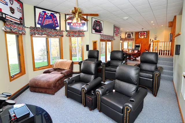a living room with furniture and a floor to ceiling window
