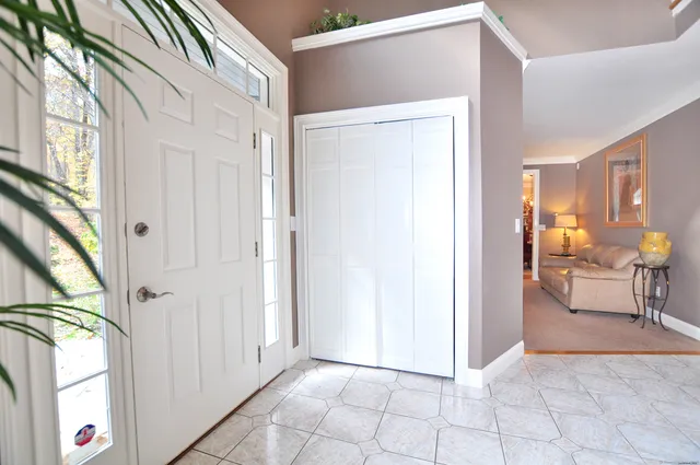 a view of an entryway with livingroom