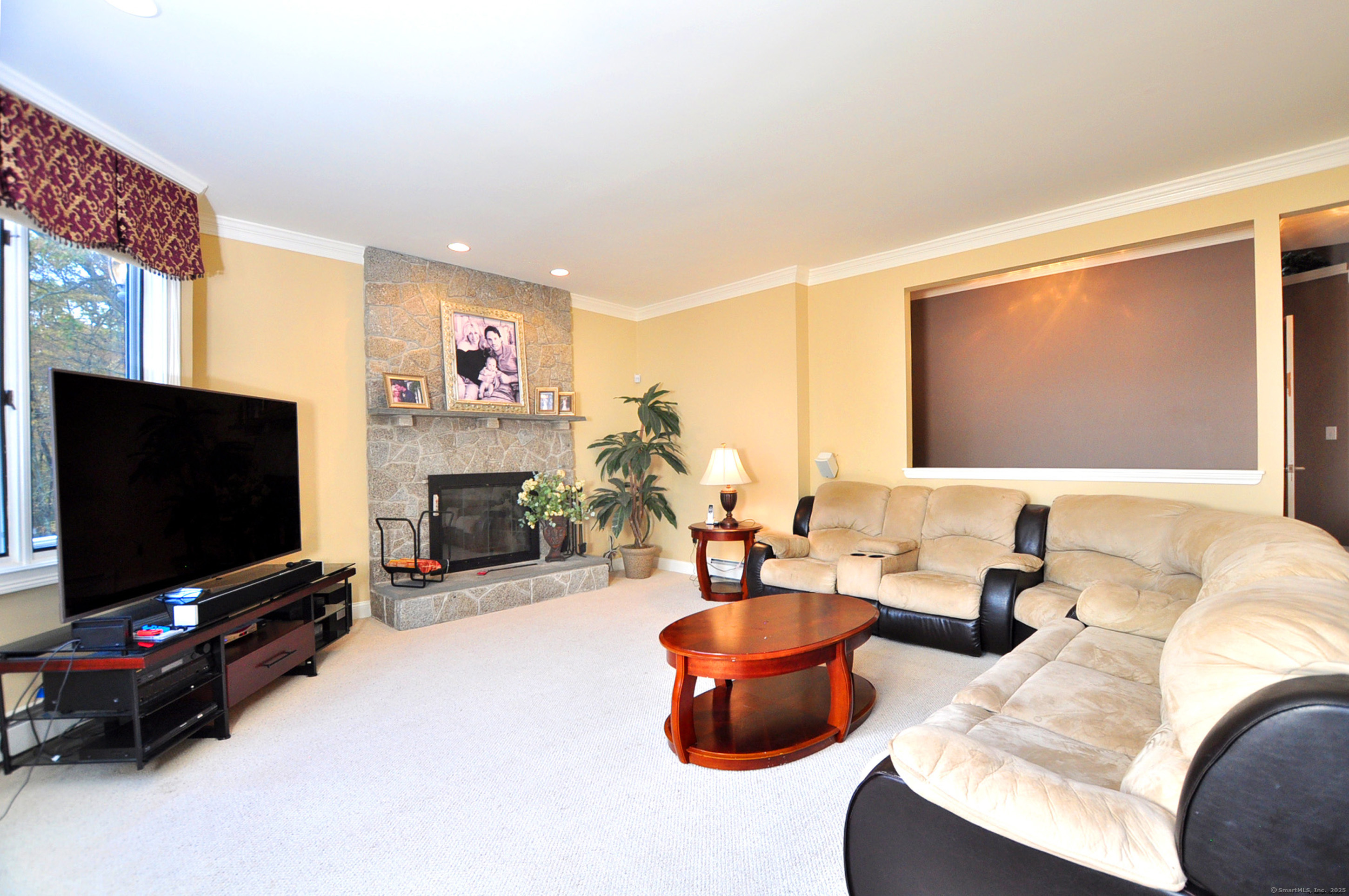 45 Lookout Landing Bolton, CT 06043 - Photo 35 of 39 a living room with furniture and a flat screen tv