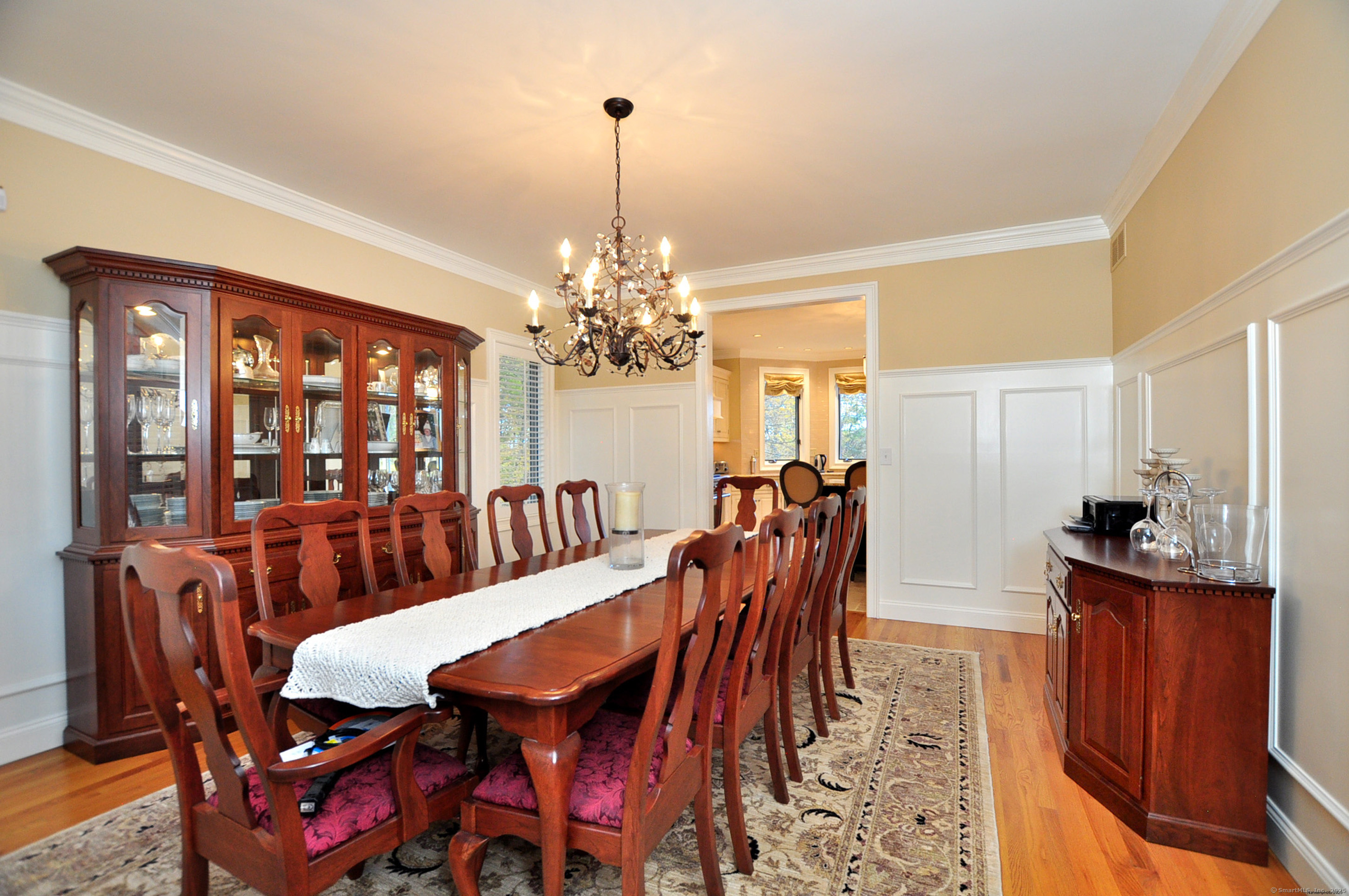 45 Lookout Landing Bolton, CT 06043 - Photo 8 of 39 a dining room with furniture a chandelier and wooden floor