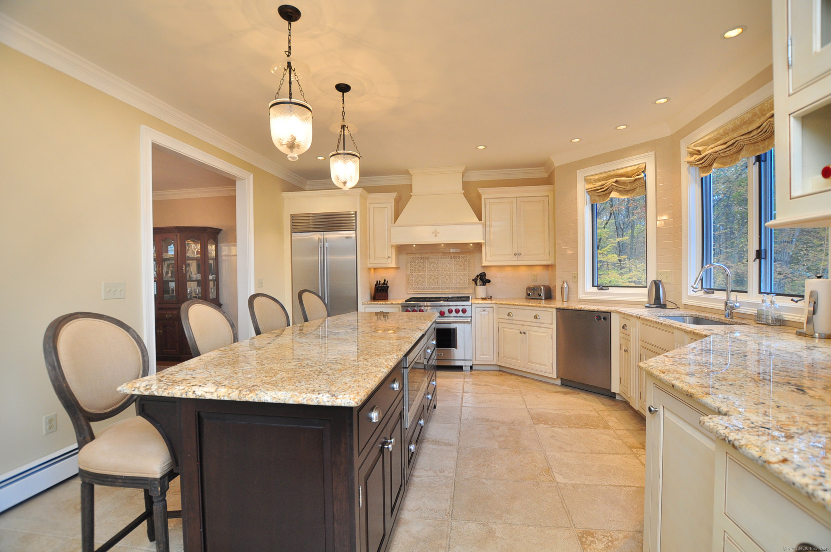 45 Lookout Landing Bolton, CT 06043 - Photo 9 of 39 a large kitchen with granite countertop a stove a sink a window and dining table