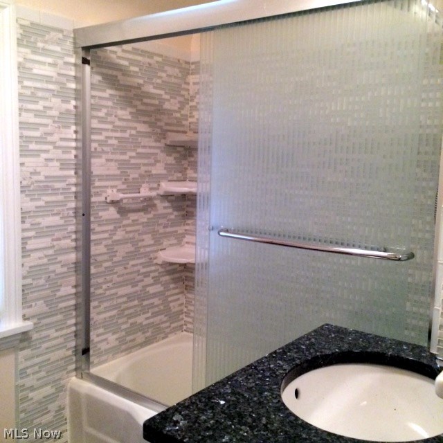 2551 Milton Road Cleveland, OH 44118 - Photo 17 of 25 Beautifully remodeled main bath has granite counter and tiled walls