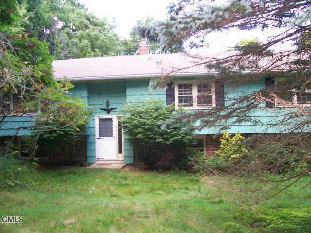 12 Mt Pleasant Road Newtown, CT 06470 - Photo 1 of 1 a view of a house with a garden and plants