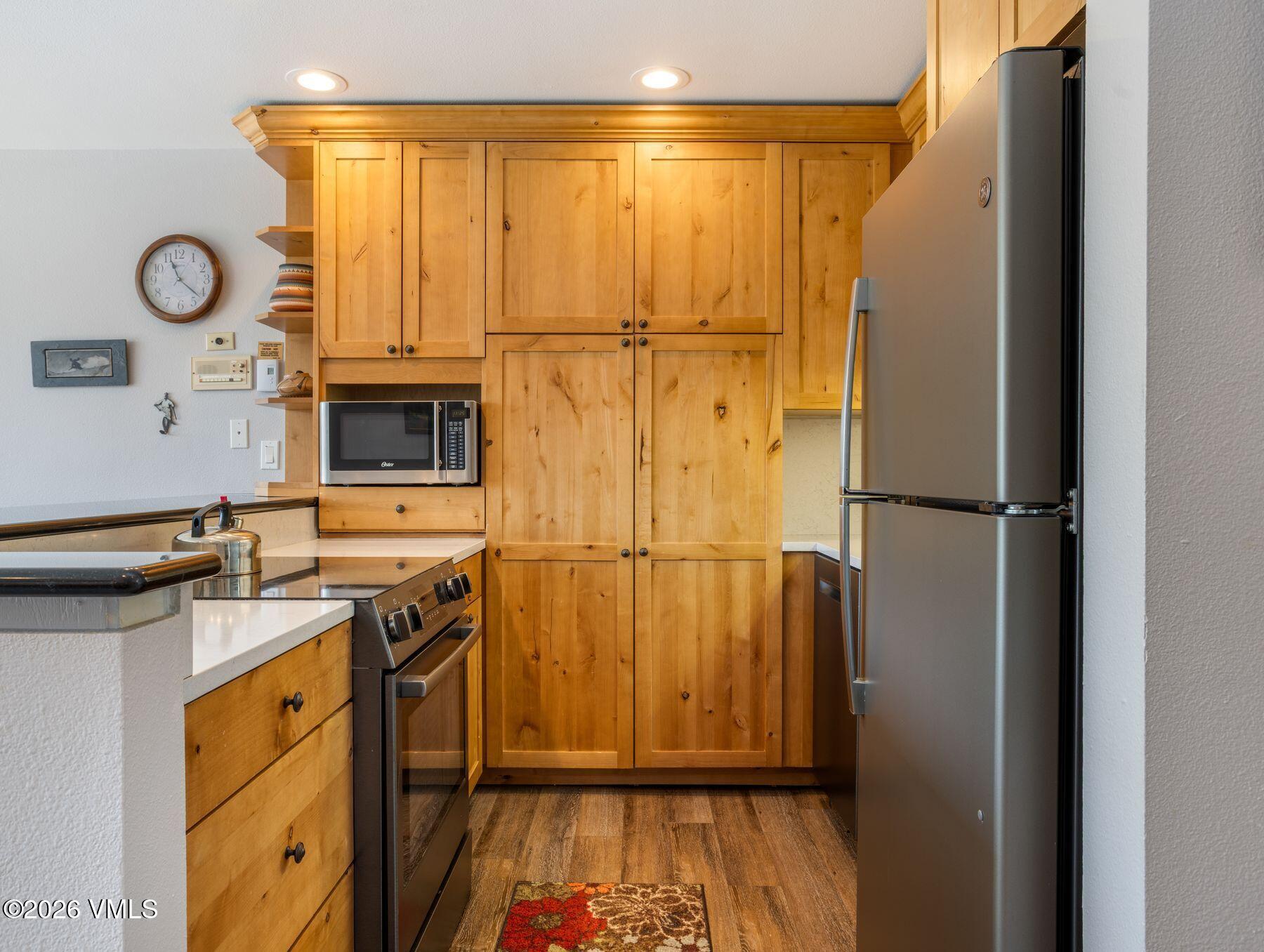 1100 North Frontage Road West, Unit 1503 Vail, CO 81657 - Photo 5 of 32 a view of a storage & utility room with washer and dryer