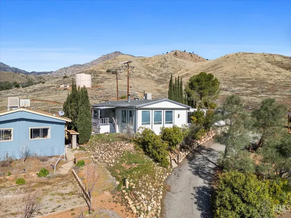 a view of a house with a mountain