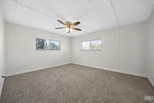 a view of empty room with windows