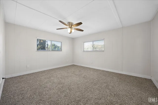 a view of empty room with windows