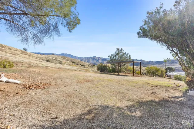 a view of beach and mountains