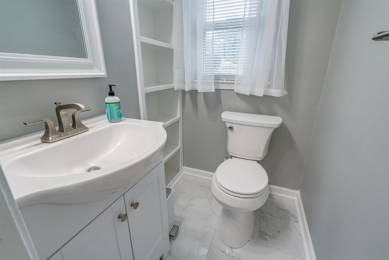 5111 Sea Isle Road Memphis, TN 38117 - Photo 14 of 24 Toilet, sink, fixtures and paint.