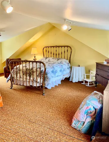 a bed room with a bed and a couch