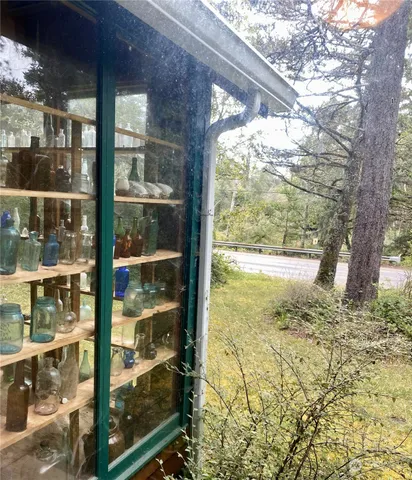 a view of a glass door and a yard