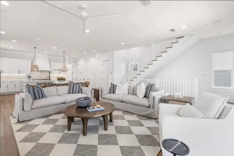 a view of a dining room with furniture wooden floor and a flat screen tv