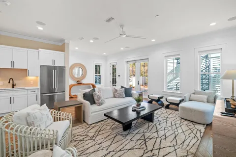 a large kitchen with kitchen island a white counter space a sink stainless steel appliances and cabinets