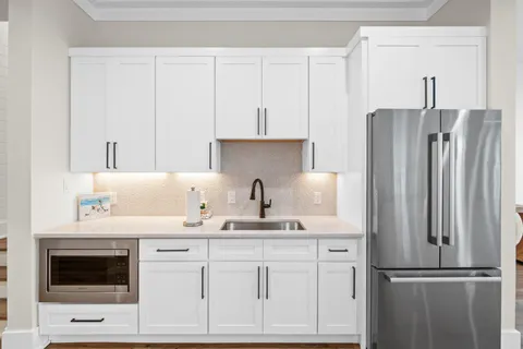 a bathroom with a toilet and a mirror