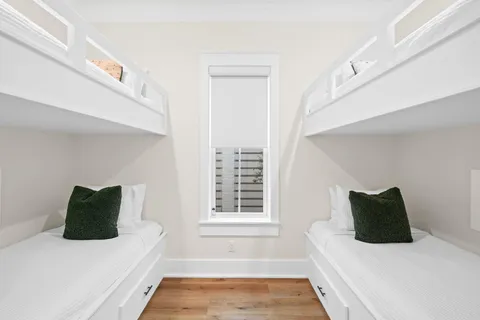 a view of a balcony with wooden floor