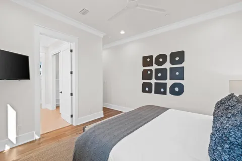 a view of a patio with table and chairs with wooden floor and fence
