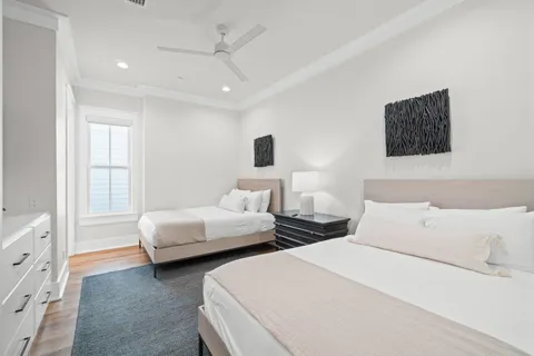 a bedroom with a bed and flat screen tv