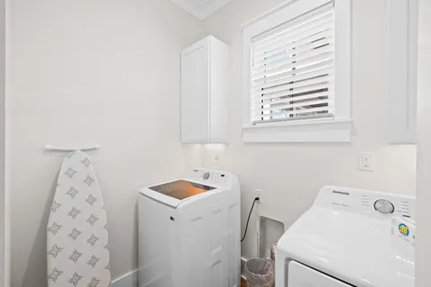 a front view of a residential apartment building with a yard