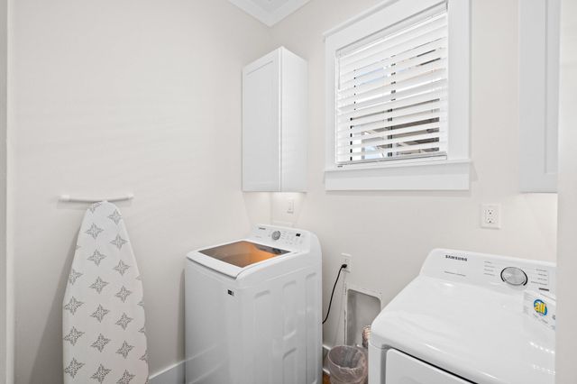 a front view of a residential apartment building with a yard