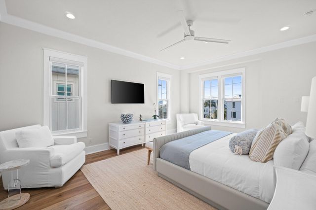 a view of a house with a sink and potted plants