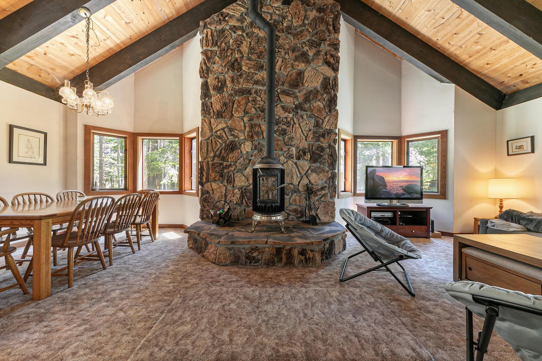 14620 Christie Lane Truckee, CA 96161 - Photo 14 of 28 a living room with furniture a flat screen tv and a fireplace