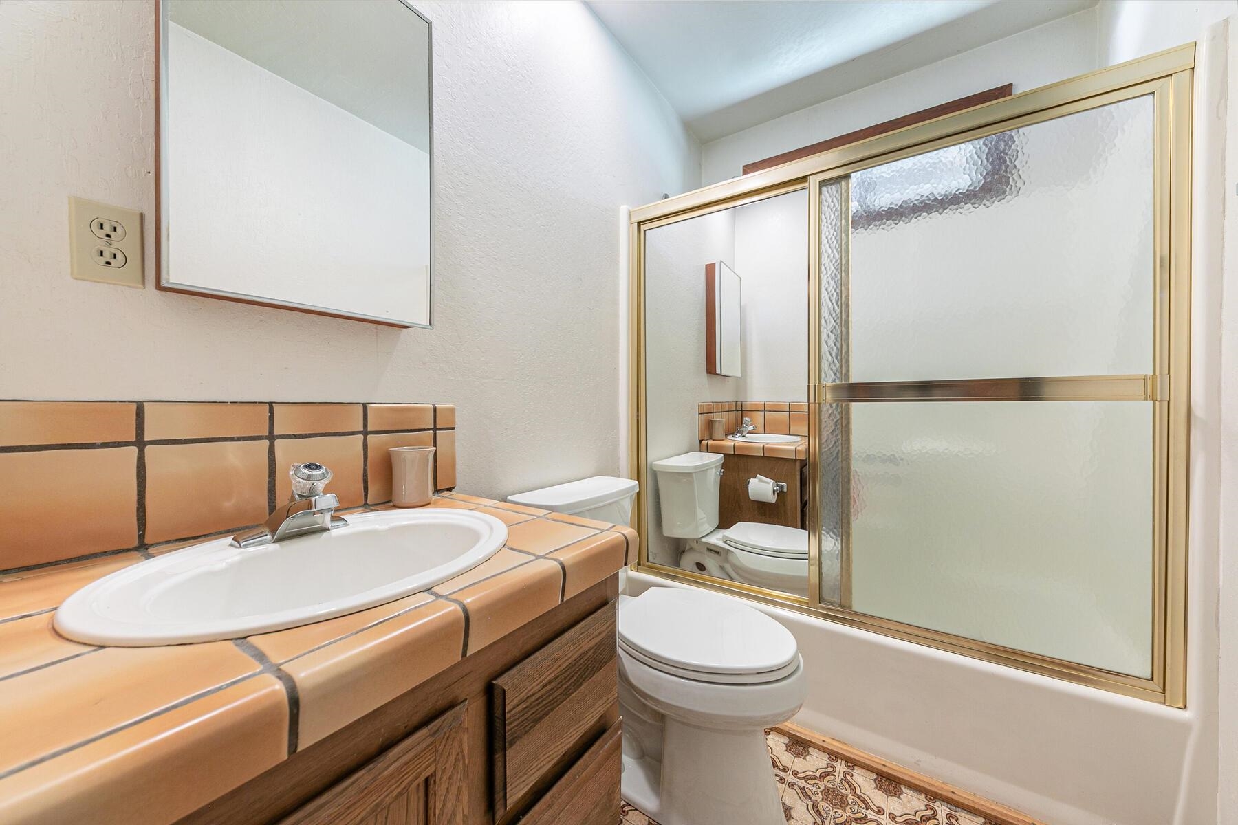 14620 Christie Lane Truckee, CA 96161 - Photo 23 of 28 a bathroom with a sink toilet and shower