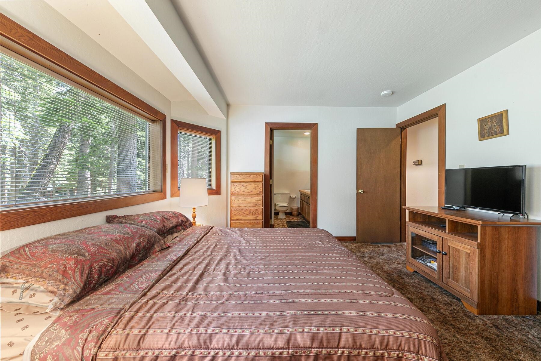 14620 Christie Lane Truckee, CA 96161 - Photo 26 of 28 a bedroom with a bed and a flat screen tv