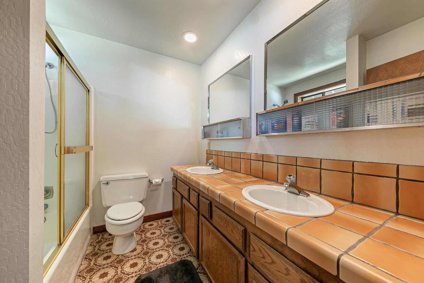 14620 Christie Lane Truckee, CA 96161 - Photo 27 of 28 a bathroom with a sink toilet and shower