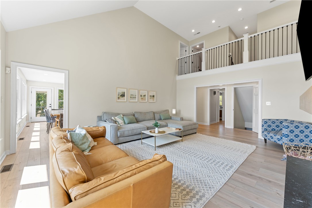 622 Jackson Road Anderson, SC 29626 - Photo 13 of 50 A spacious, airy living room featuring soaring vaulted ceilings and light hardwood flooring.