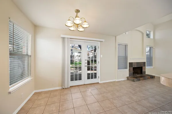 a view of an empty room with a fireplace
