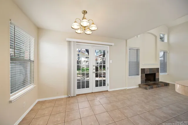 a view of an empty room with a fireplace