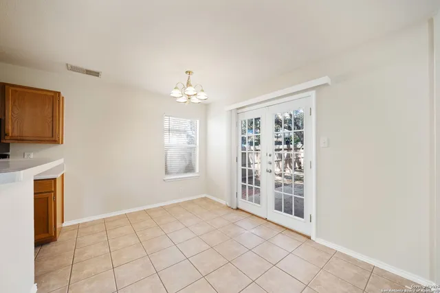 a view of an empty room with a fireplace