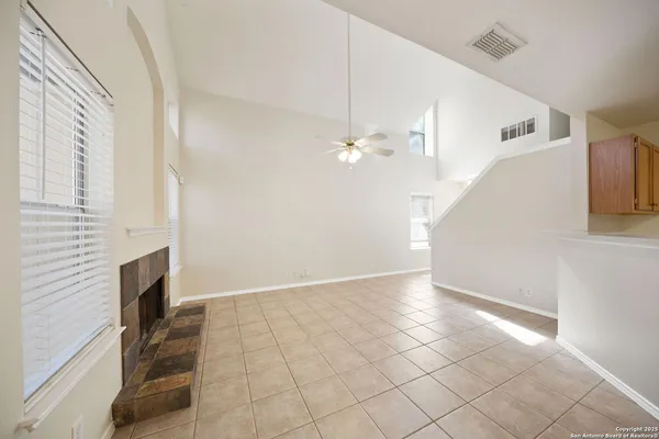 a view of an empty room with white walls