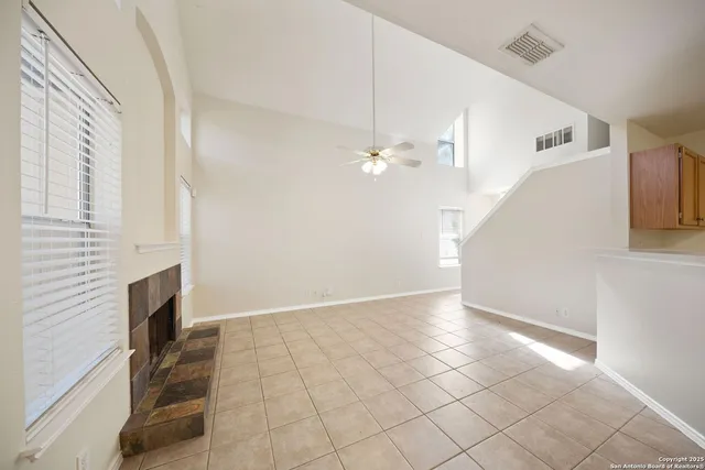 a view of an empty room with white walls