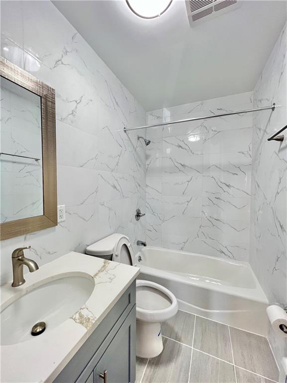 1651 85th Street Brooklyn, NY 11214 - Photo 12 of 17 a bathroom with a sink a toilet and shower