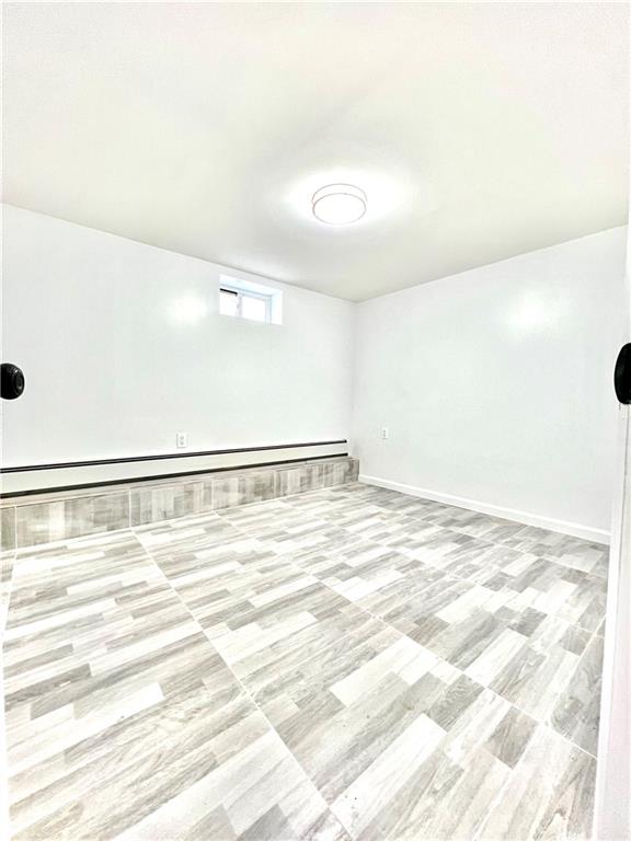 1651 85th Street Brooklyn, NY 11214 - Photo 14 of 17 a view of a room with an empty space