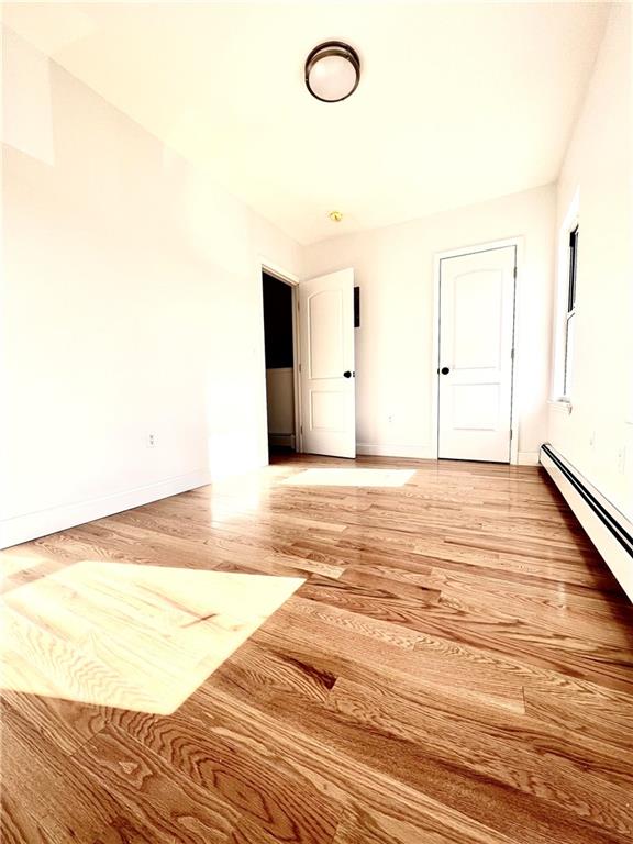 1651 85th Street Brooklyn, NY 11214 - Photo 8 of 17 a view of a room with wooden floor
