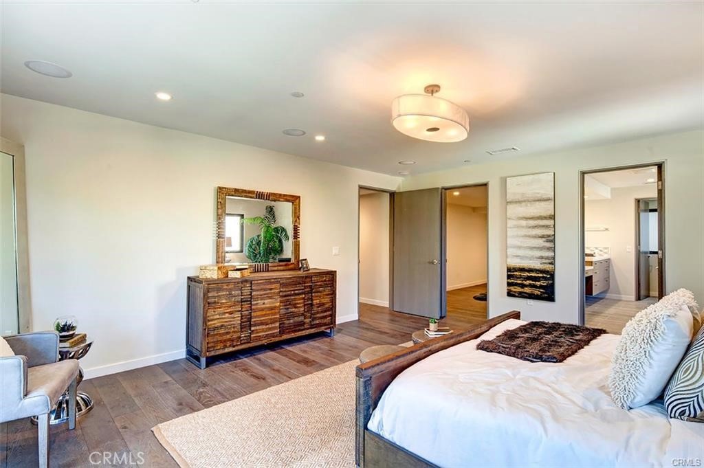 606 Boundary Place Hermosa Beach, CA 90266 - Photo 11 of 13 a bedroom with a bed and wooden floor
