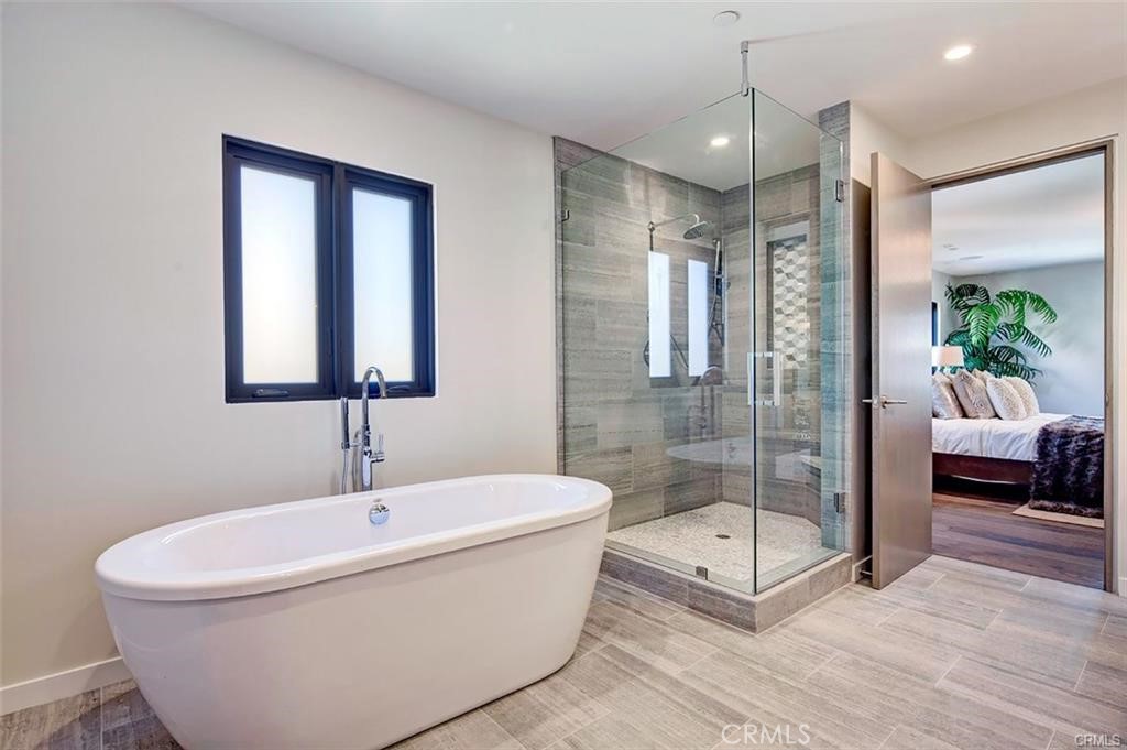 606 Boundary Place Hermosa Beach, CA 90266 - Photo 13 of 13 a bathroom with a white tub shower and mirror