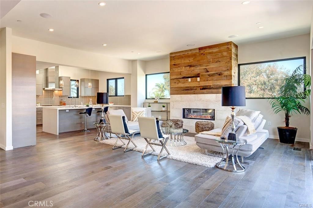 606 Boundary Place Hermosa Beach, CA 90266 - Photo 2 of 13 a living room with furniture and a fireplace