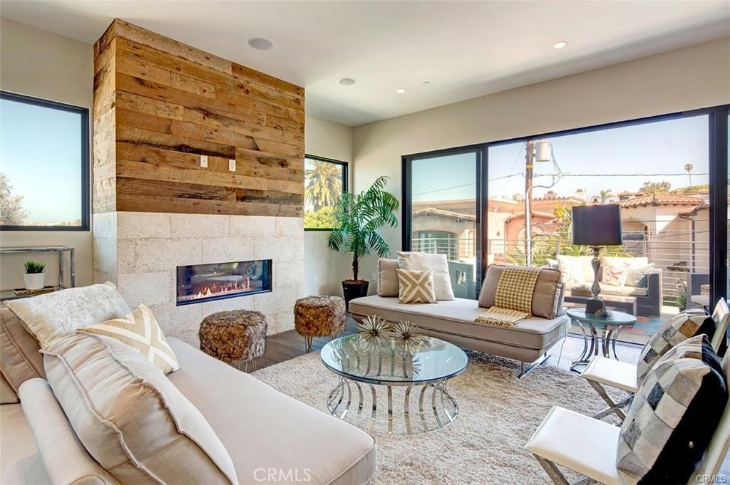 606 Boundary Place Hermosa Beach, CA 90266 - Photo 4 of 13 a living room with furniture fireplace and a large window