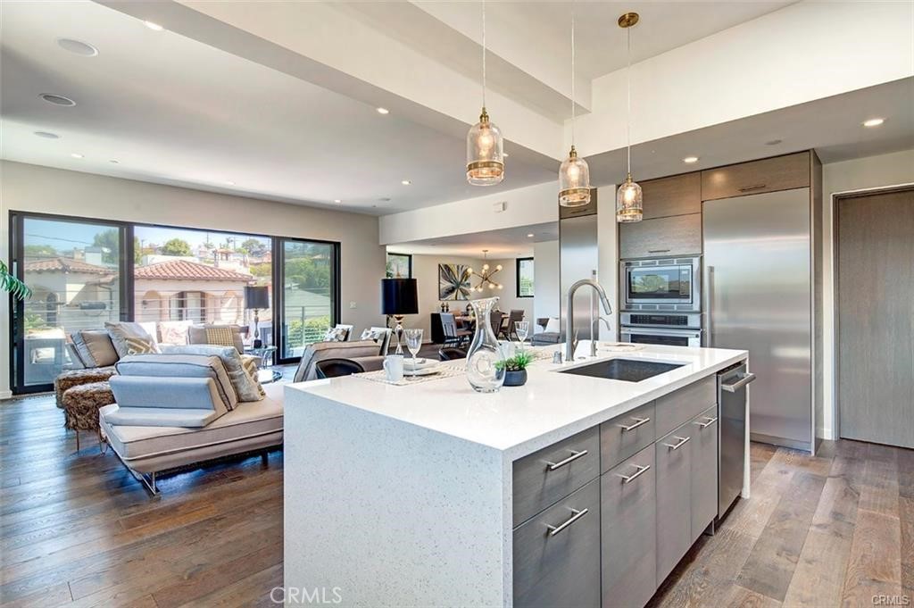 606 Boundary Place Hermosa Beach, CA 90266 - Photo 6 of 13 a large white kitchen with a large window